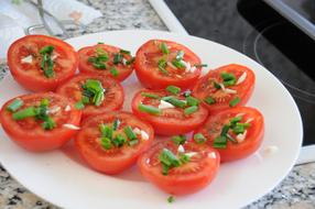 Sliced tomatoes and herbs