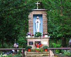 Beautiful and colorful chapel with the cross and plants