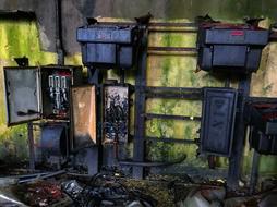 lapsed electrical equipment on wall in Abandoned factory