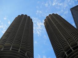 Beautiful towers at blue sky with white clouds on background in Chicago, USA