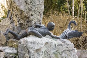 Sculpture boy and bird