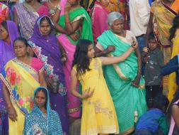 Girl, taking selfie, with the colorful people