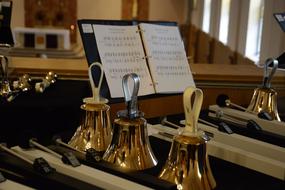 golden bells and music book in the church