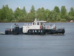 a ship sailing on a long river
