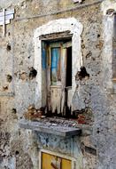 facade of a destroyed building in the old town in italy