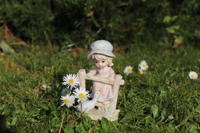 Girl and bird garden figurine