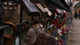 rusty padlocks on the bridge at dusk close up