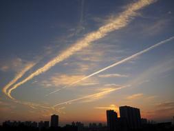 Silhouettes of the city, at beautiful and colorful sunset, with the clouds