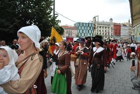 People in colorful costumes on Brno Day in Czech Republic in 2016