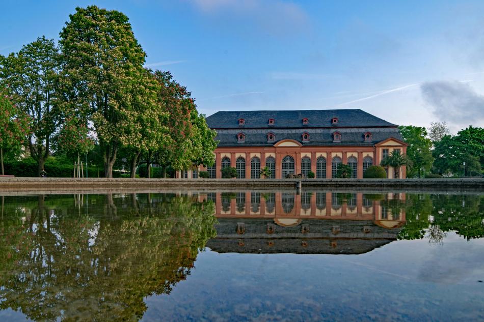 Beautiful and colorful orangery, on the shore of the fountain, among the colorful trees, in Darkmstadt, Hesse, Germany