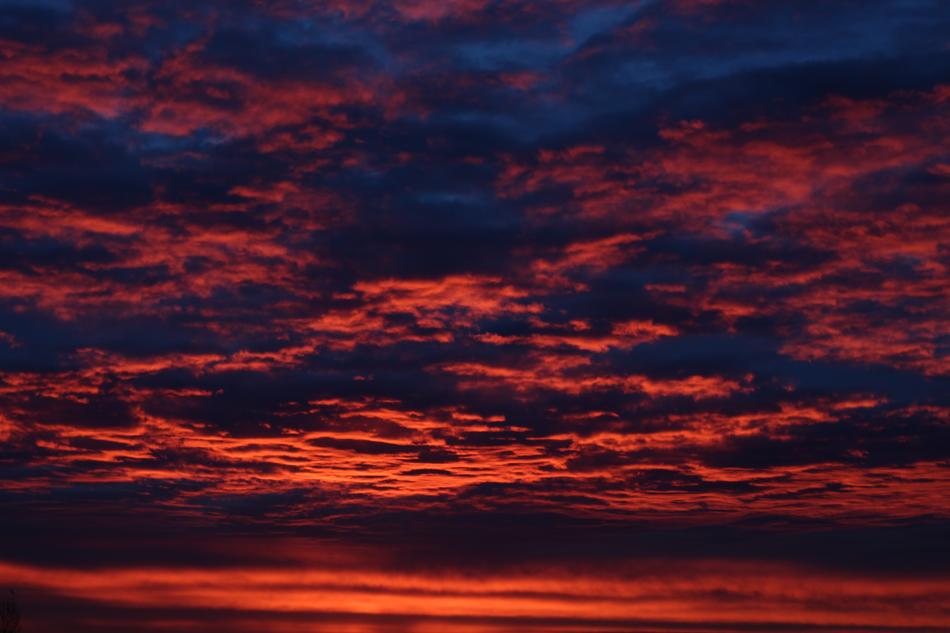 the red sky with blue clouds is unusual