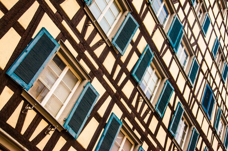 Beautiful and colorful Truss house, with the windows with the shutters, in light