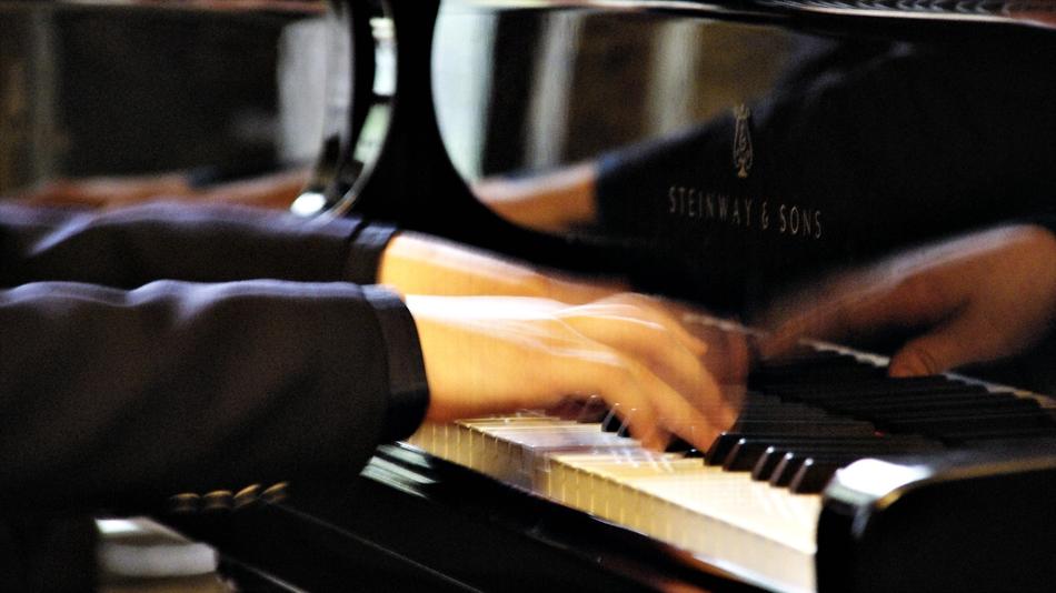The pianist's hands are playing