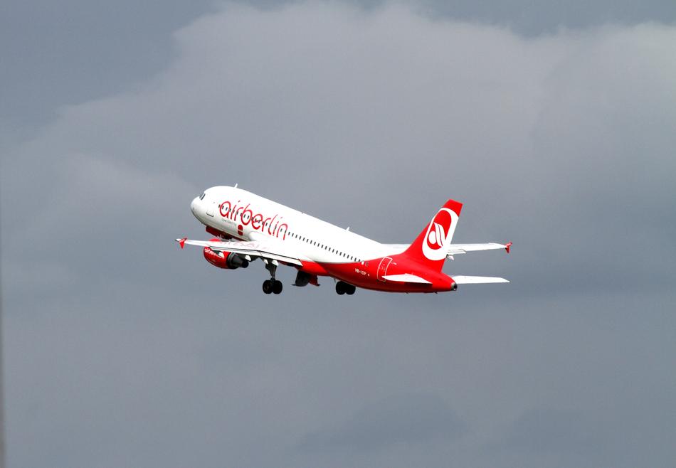 airplane rising in the gray sky