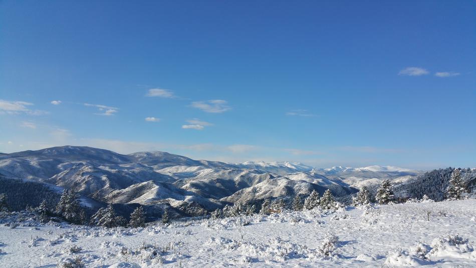 snow valley with mountains in the background