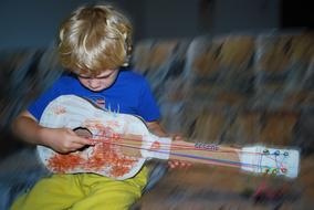 small Boy Playing Guitar