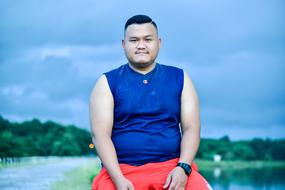 young man on blurred nature background