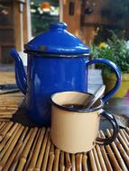 blue teapot by the coffee mug