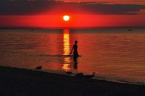 Girl Sea Beach and red sun