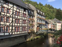 photo of old traditional buildings on riverside in Monschau, Germany