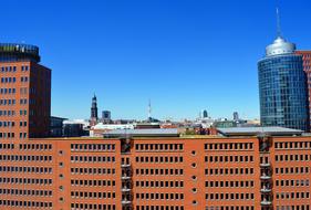 Colorful buildings in Hamburg, Germany, at blue, gradient sky on background