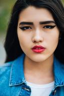 young asian girl with bright makeup