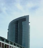 Shiny building, with the windows, in Frankfurt, Germany, under the blue sky with clouds