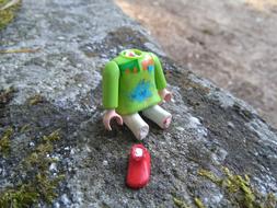 the green figurine is broken