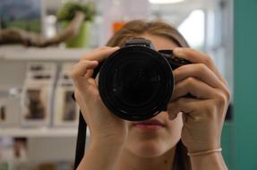 Girl with Camera at face