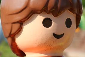 macro photo of a lego human head