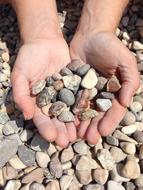 Hands holding Stones Pebbles