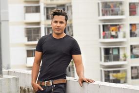 photo of stylish guy on the balcony