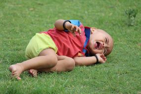 Crying Baby on green grass