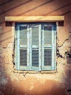 Old Wooden Window on broken wall