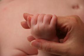 Baby and woman Hands