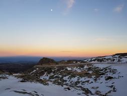 snowy mountain at sunset