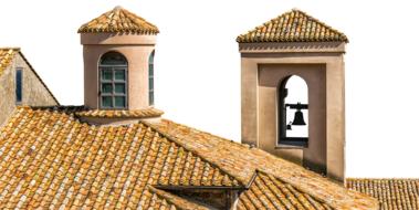 bell tower on the roof of a building in Italy