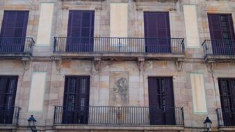 facade of an old building with balconies in barcelona