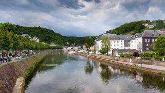 Beautiful river among the green trees in Bouillon, Belgium