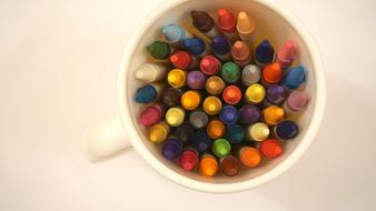 colored pencils in a cup