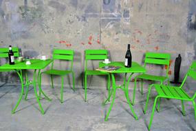 green chairs with tables