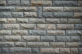 Texture of the colorful granite wall with blocks, clipart