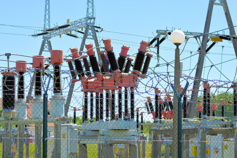 Electricity factory behind the fence, under the blue sky