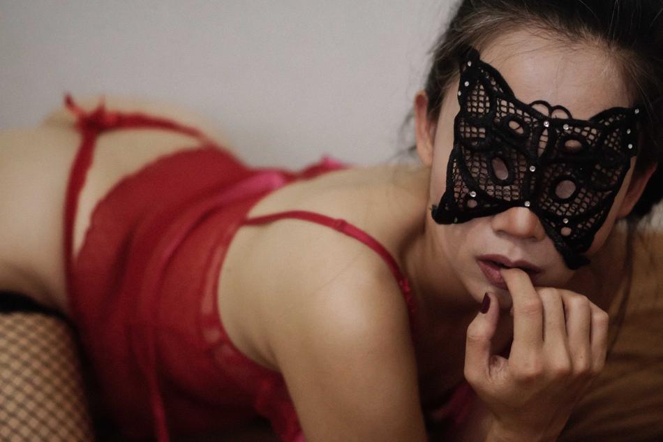 girl lying in a mask