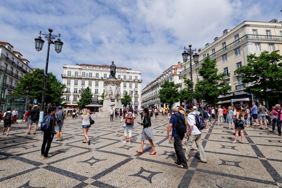 people in the square in the center of lisbon
