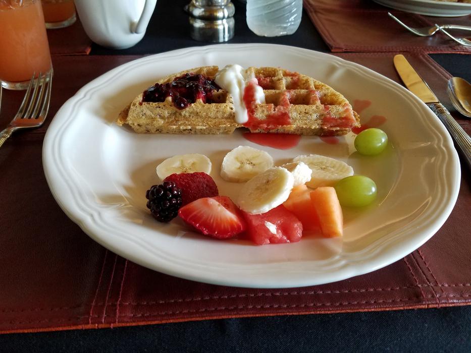 Breakfast of waffles and fruit