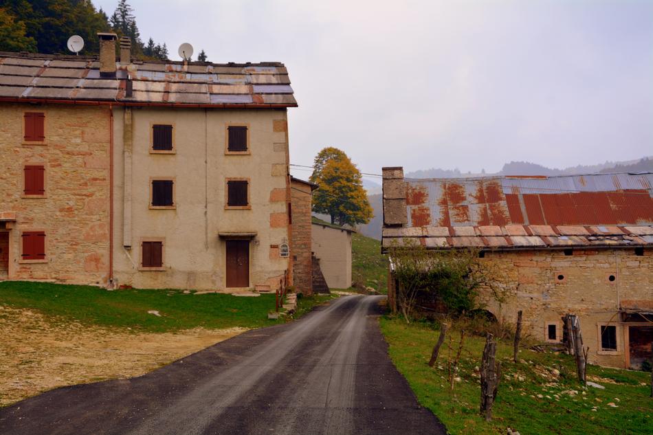 yellow house with a road