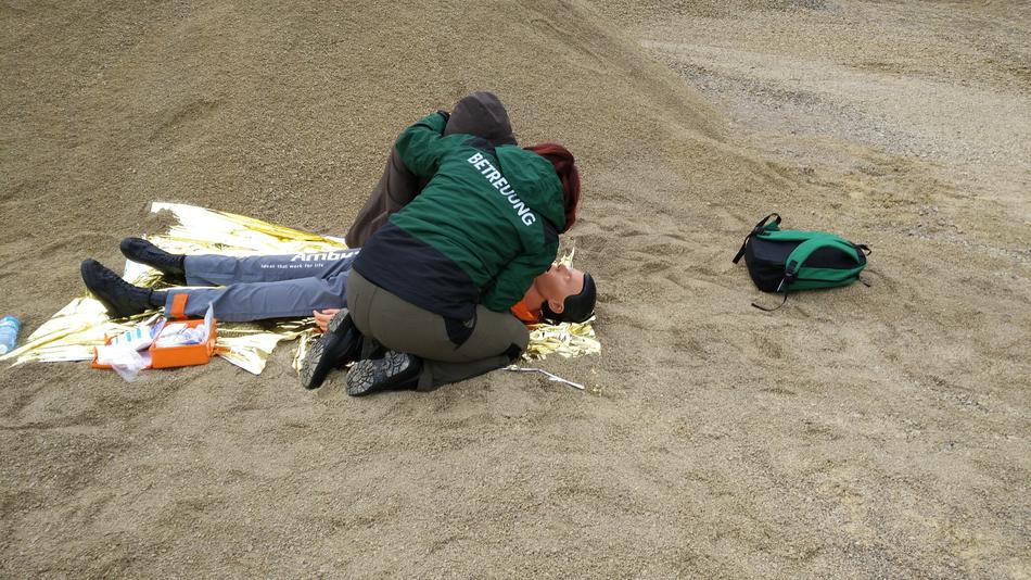 People of Red Cross, on the exercise for helping people, on the sand