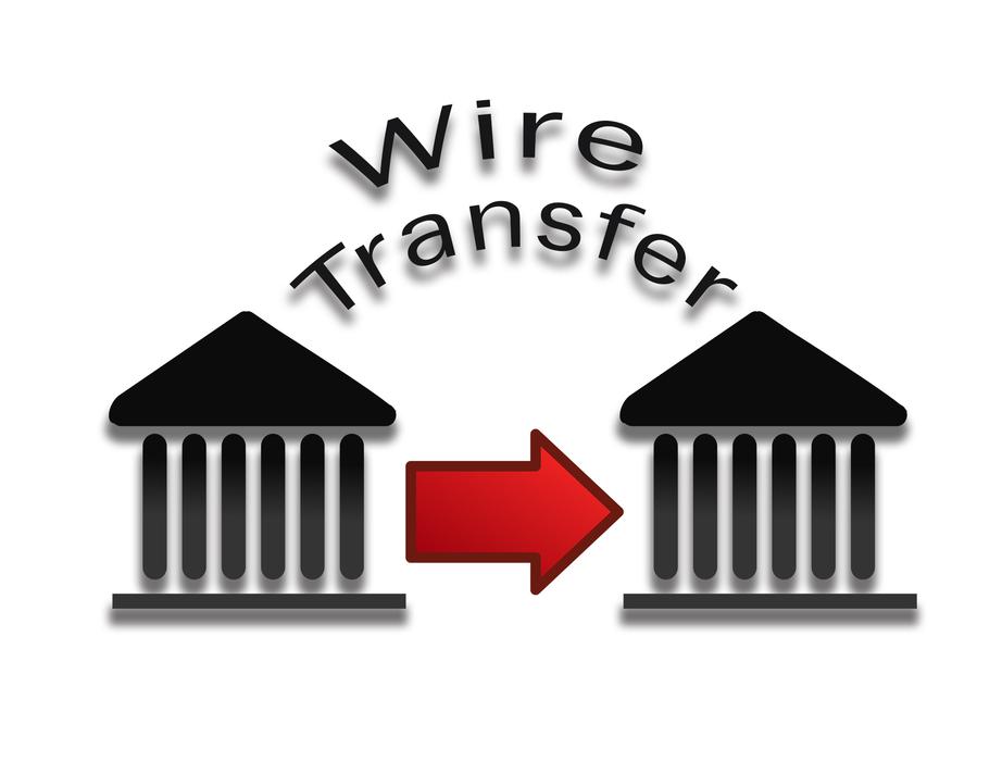 'Wire transfer' sign with arrow among the buildings, clipart