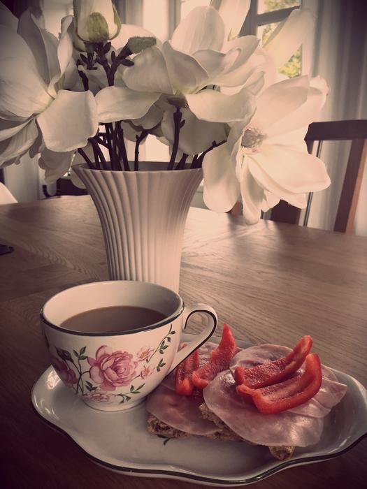 white flowers near the coffee